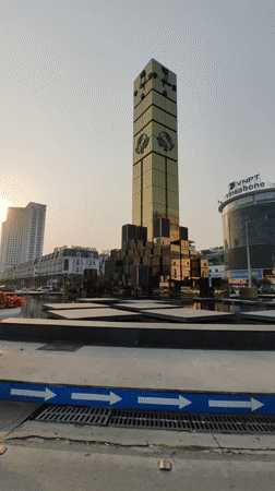 Golden clock tower fountain documented in Hong Gai Ward Vietnam