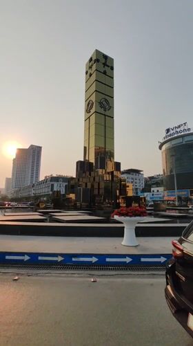 Golden clock tower fountain documented in Hong Gai Ward Vietnam