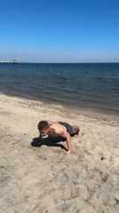 Man performs gymnastics at Burgas beach exercise park