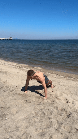 Man performs gymnastics at Burgas beach exercise park