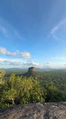 Tourist documents panoramic views of Sigiriya rock fortress, Sri Lanka