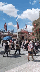 Political demonstration with banners unfolds in Buenos Aires Plaza de Mayo