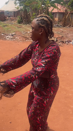 Woman dances in traditional outfit in Ogbe, Nigeria