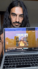 Man displays Lana Del Rey album on laptop in Indonesia