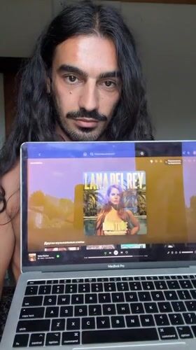 Man displays Lana Del Rey album on laptop in Indonesia