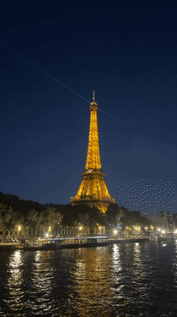 Eiffel Tower illuminated golden against evening skies in Paris