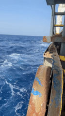 Ship passenger documents Mediterranean sea views near Greece