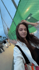 Woman films herself walking in Glifada coastal area