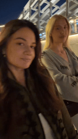 Nighttime street scenes captured in Belgrade featuring women and musician