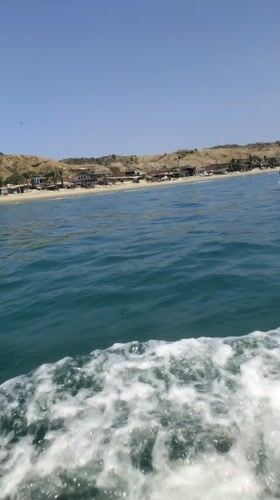 Boats navigate waters off Cancas, Peru coast