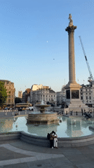 Trafalgar Square at sunset, fountains and landmarks in focus