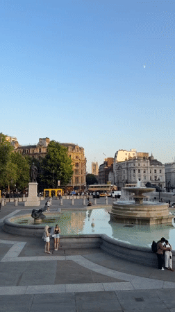 Trafalgar Square at sunset, fountains and landmarks in focus