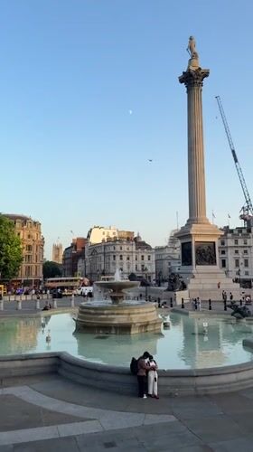Trafalgar Square at sunset, fountains and landmarks in focus