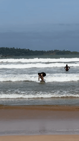 Morning beach activities and surfing lessons observed at Weligama