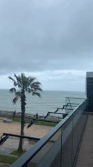 Overcast skies and choppy seas observed from Batumi balcony