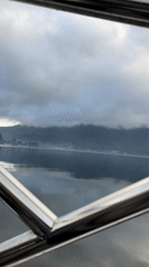 Lake and mountain view recorded from boat near Baturiti