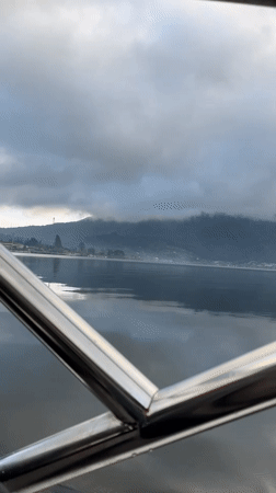 Lake and mountain view recorded from boat near Baturiti