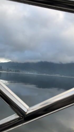 Lake and mountain view recorded from boat near Baturiti
