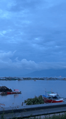 Woman films evening stroll along Davao City waterfront walkway