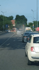 Urban traffic jam with white smoke reported