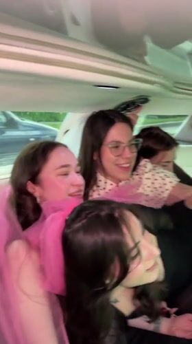 Young women sing Russian pop songs in luxury vehicle