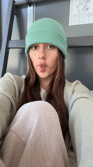 Woman takes morning selfies in Tel Aviv apartment