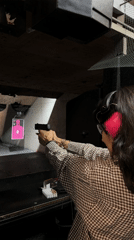 Woman practices target shooting at LA indoor range early morning