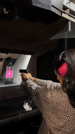 Woman practices target shooting at LA indoor range early morning