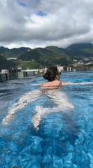 Late night swimming captured at Beppu rooftop pools