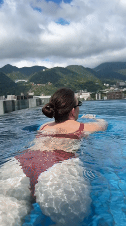 Late night swimming captured at Beppu rooftop pools