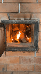 Wood fire burns in brick oven, Sestroretsk Russia