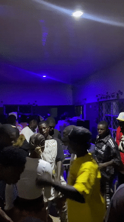 Evening social gatherings and chess games documented across Nigerian towns