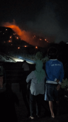 Hillside wildfire burns across Surakarta slopes after dark