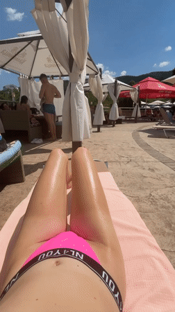 Poolside relaxation at a Bulgarian resort on a sunny afternoon