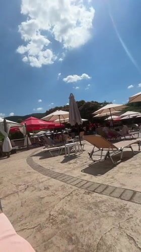 Poolside relaxation at a Bulgarian resort on a sunny afternoon