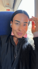 Train passenger travels through Russian countryside on sunny morning