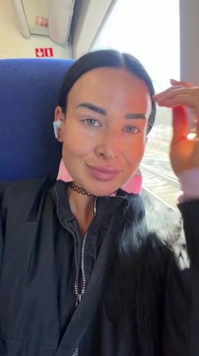 Train passenger travels through Russian countryside on sunny morning