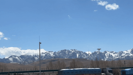 Morning parking scene documented in Wuwei with mountain backdrop