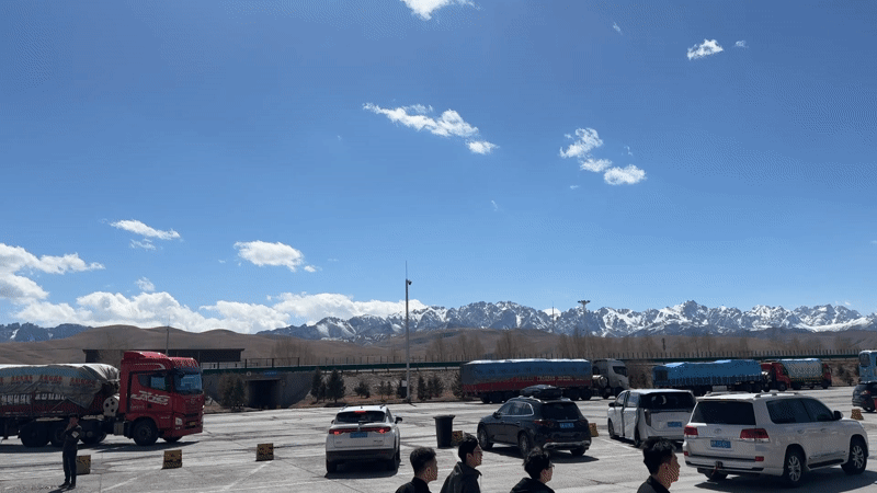 Morning parking scene documented in Wuwei with mountain backdrop