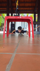 Boy plays with skateboard indoors in Mũi Né, Vietnam