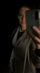 Person takes bathroom selfies in London evening