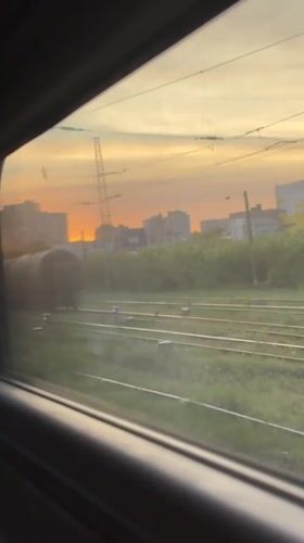 Train passenger films sunset over Ryazan city skyline