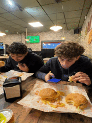 Young diners share late night meal at Bragança restaurant