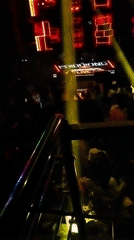 Person elevated above crowd at Nigeria nightclub venue
