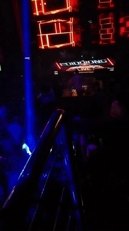 Person elevated above crowd at Nigeria nightclub venue