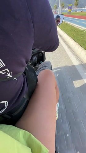Scooter rider spotted on path near running track in Fethiye