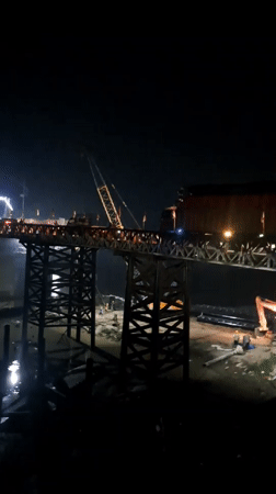 Nighttime bridge construction documented in Blang Mee, Indonesia