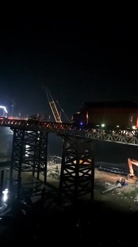 Nighttime bridge construction documented in Blang Mee, Indonesia