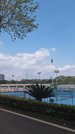 Morning view of tennis court and buildings in Chongqing