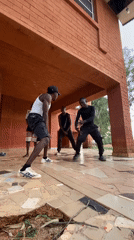 Young men perform dance routine in Kuru Karama, Nigeria